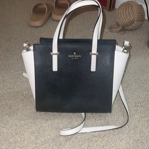 Kate spade hard leather purse. Lots of use, barely noticeable!